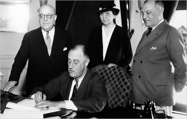 Signing the Wagner Act of 1935 into law