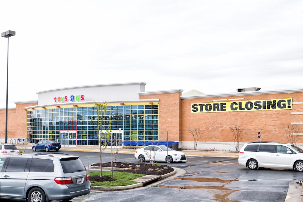 Sterling, USA - April 4, 2018: Toys R US store in Fairfax county, Virginia for children shop exterior entrance with sign, logo, doors, closing going out of business bankruptcy, nobody
